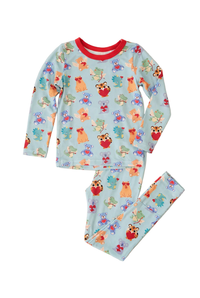 Children's pajama set with fox and flower pattern on a light blue background