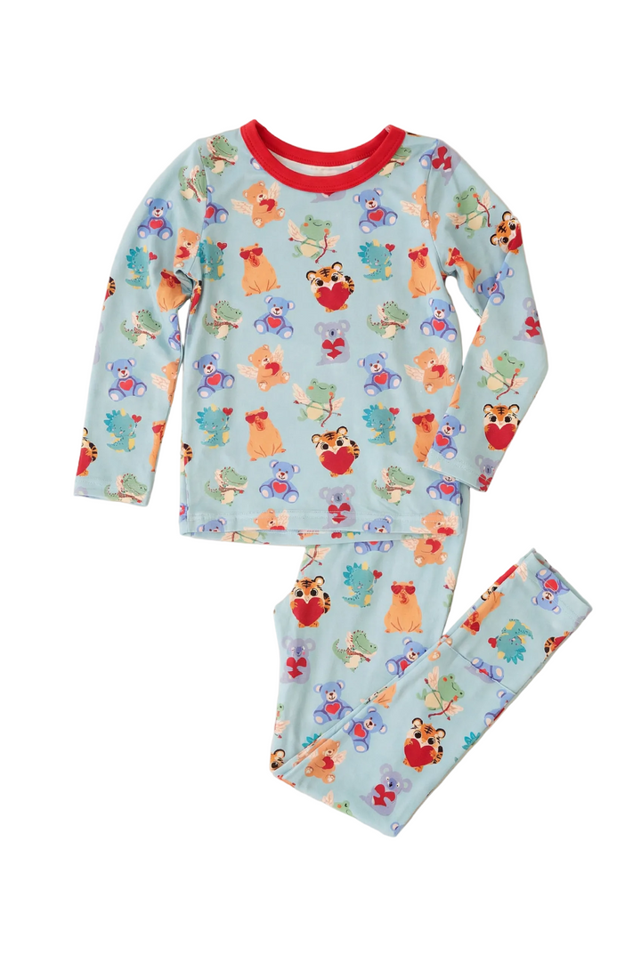 Children's pajama set with fox and flower pattern on a light blue background