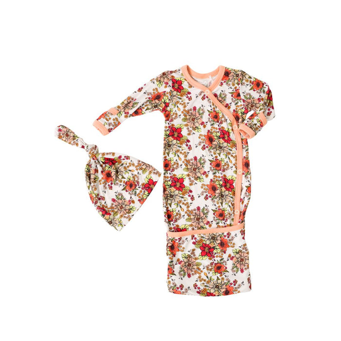 Floral baby gown and hat set on a white background