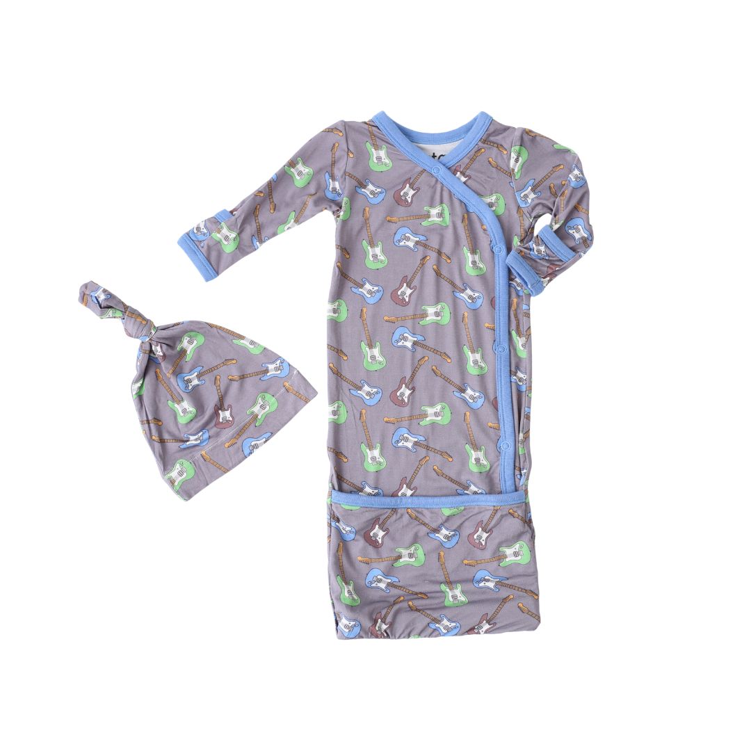 Baby wrap and hat set with guitar pattern on a white background
