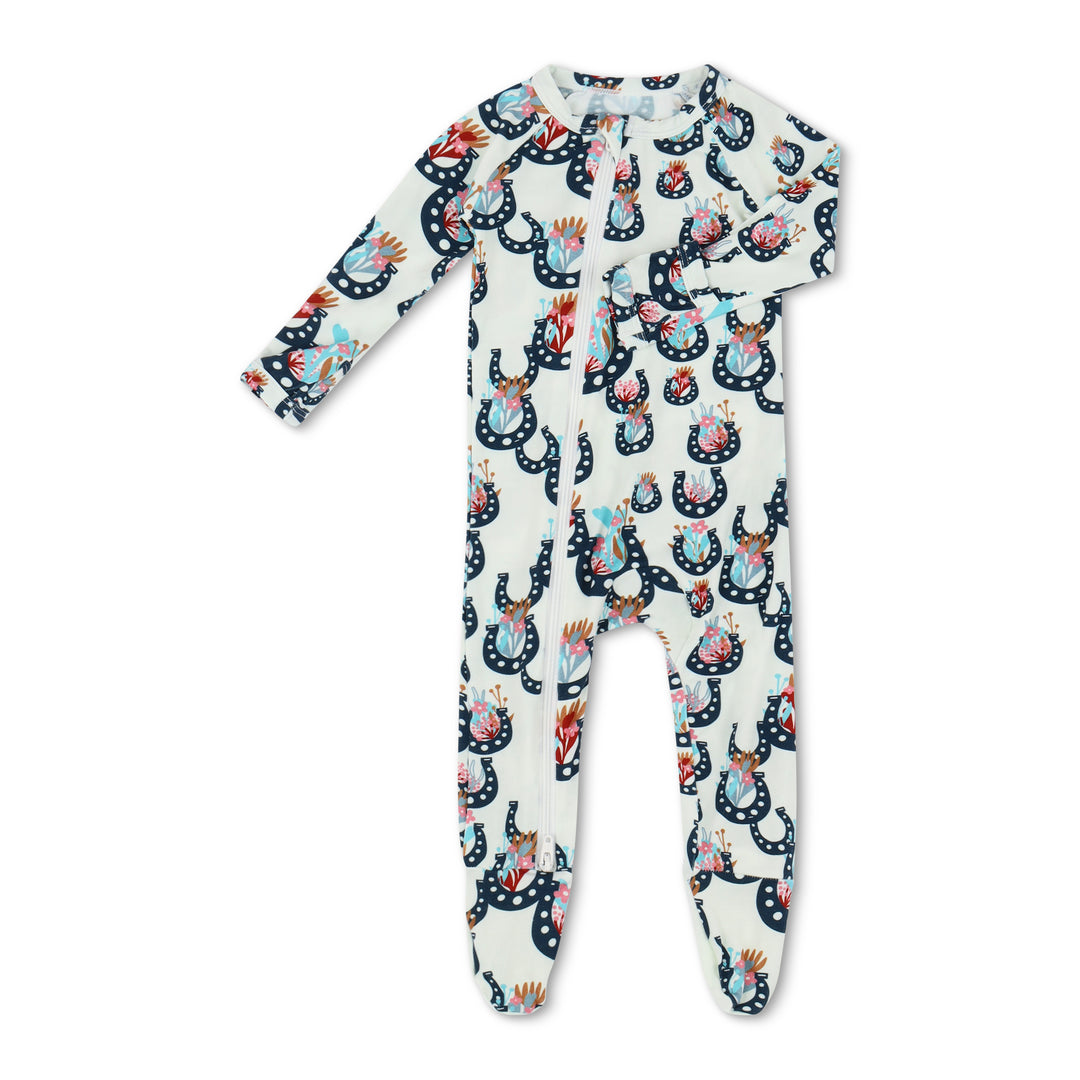 Children's onesie with colorful animal pattern on a white background