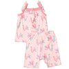 Pink children's romper with llama pattern on a textured brown surface