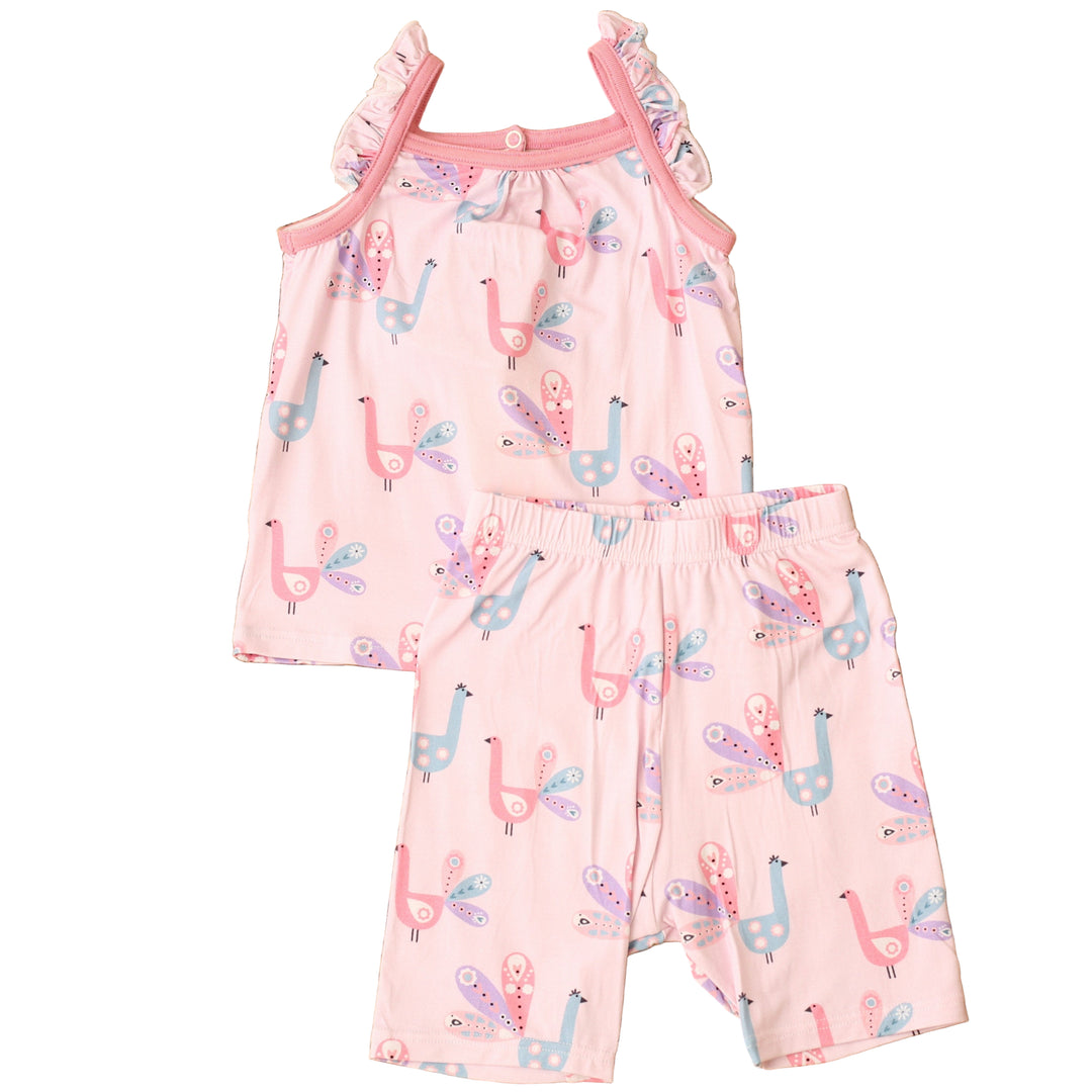 Pink children's romper with llama pattern on a textured brown surface