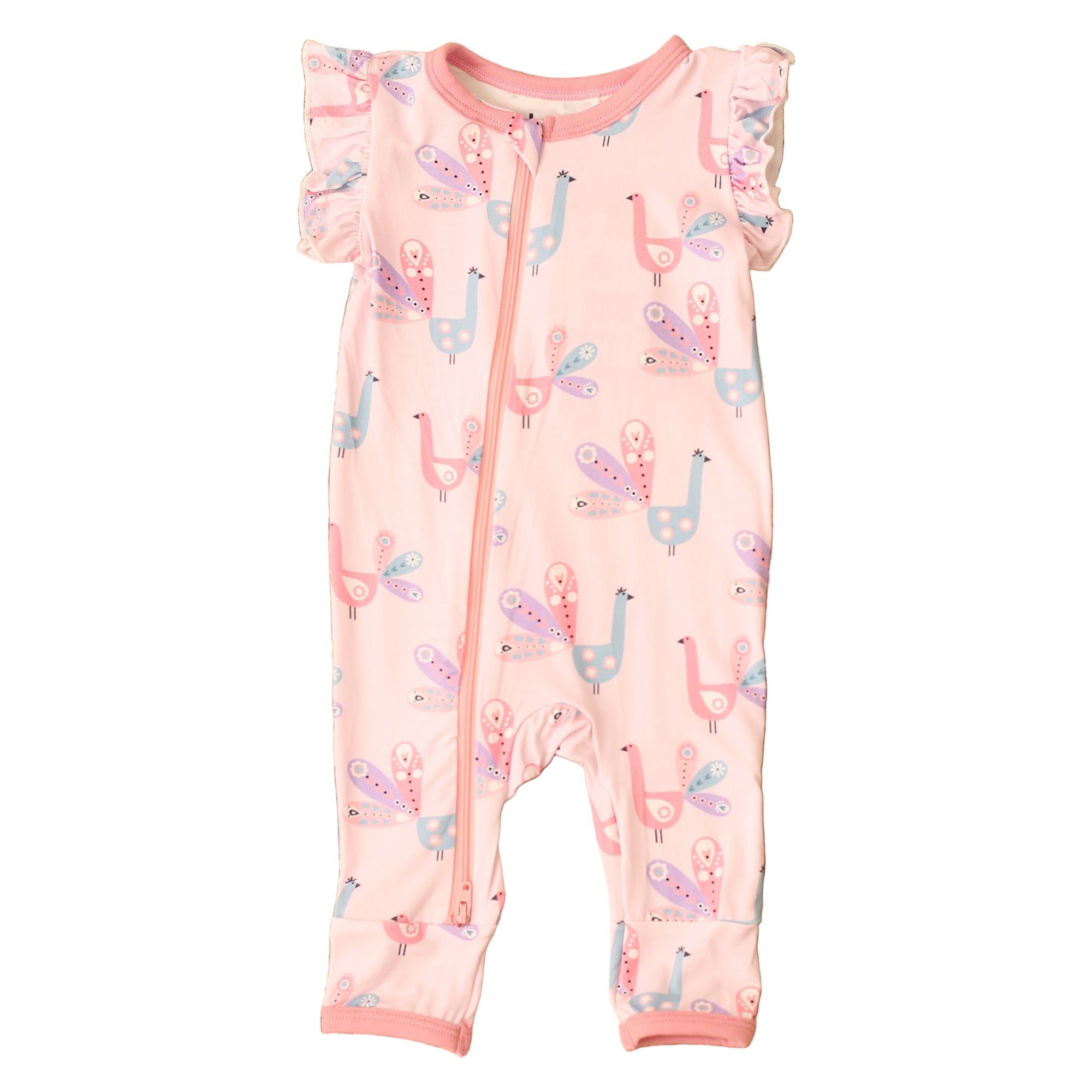 Baby romper with llama pattern on a textured brown surface