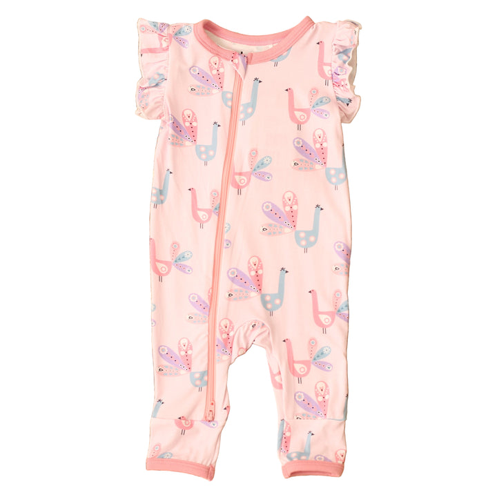 Baby romper with llama pattern on a textured brown surface