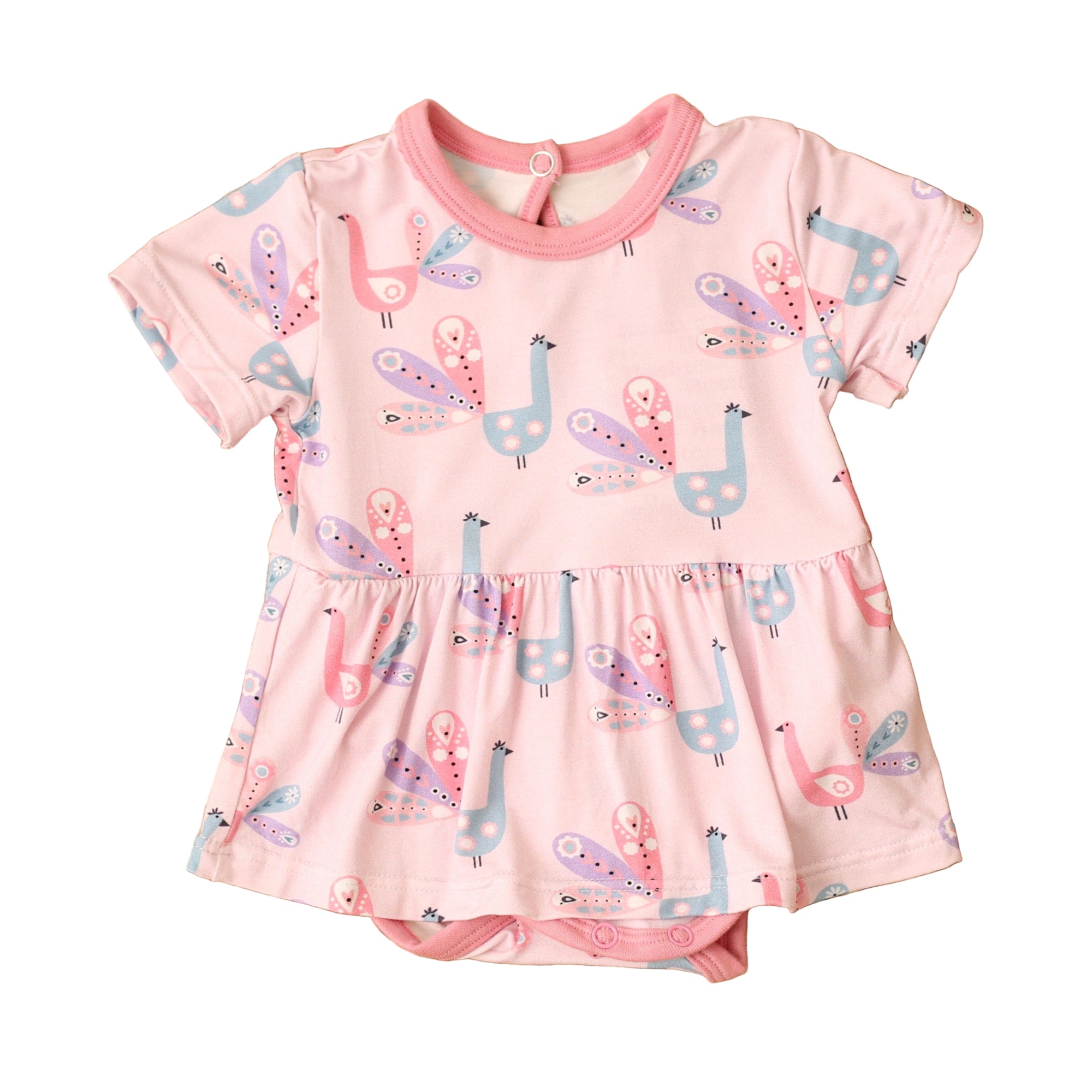 Pink dress with animal print on a textured brown surface