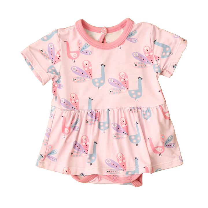 Pink dress with animal print on a textured brown surface