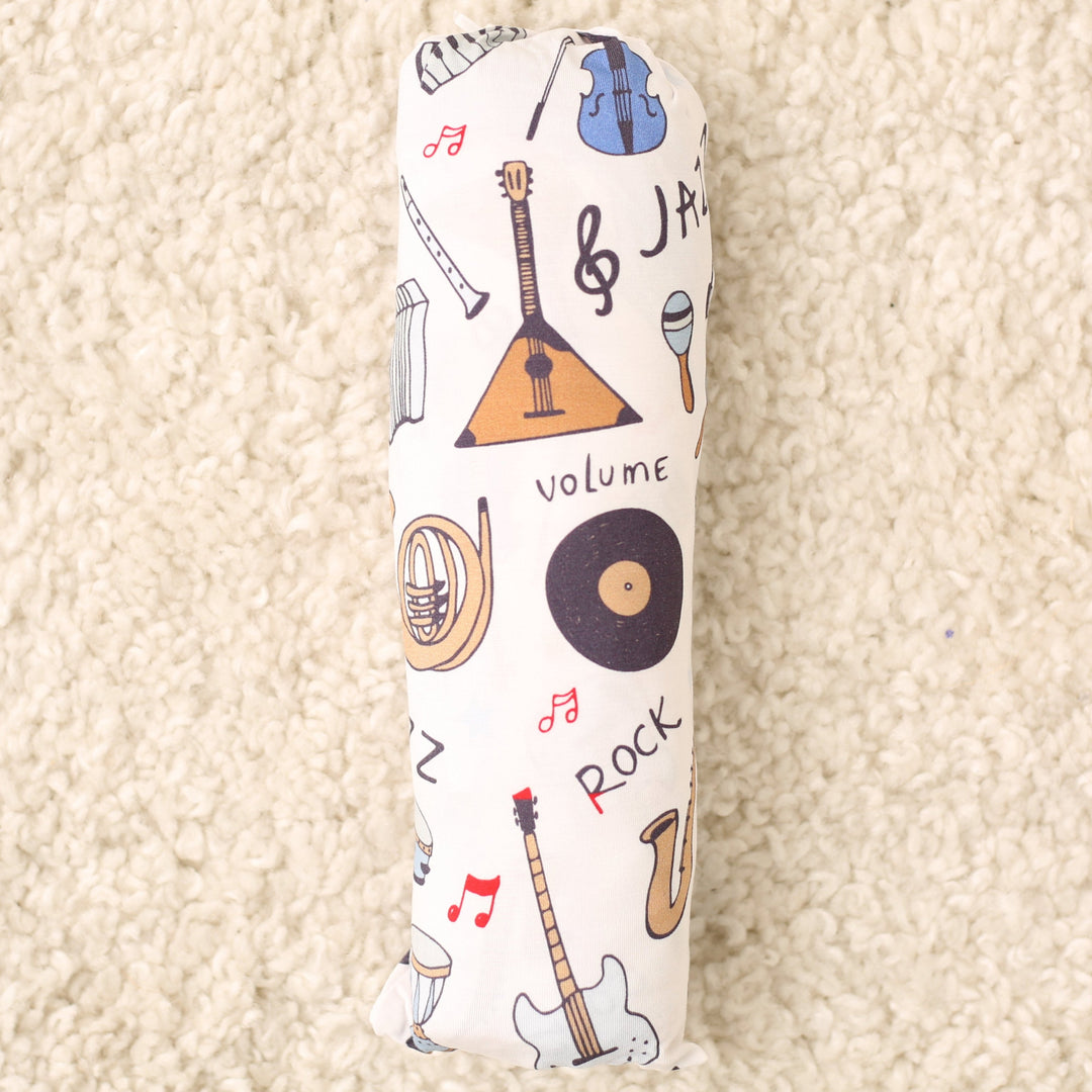 Padded instrument case with musical instrument design on a beige carpet