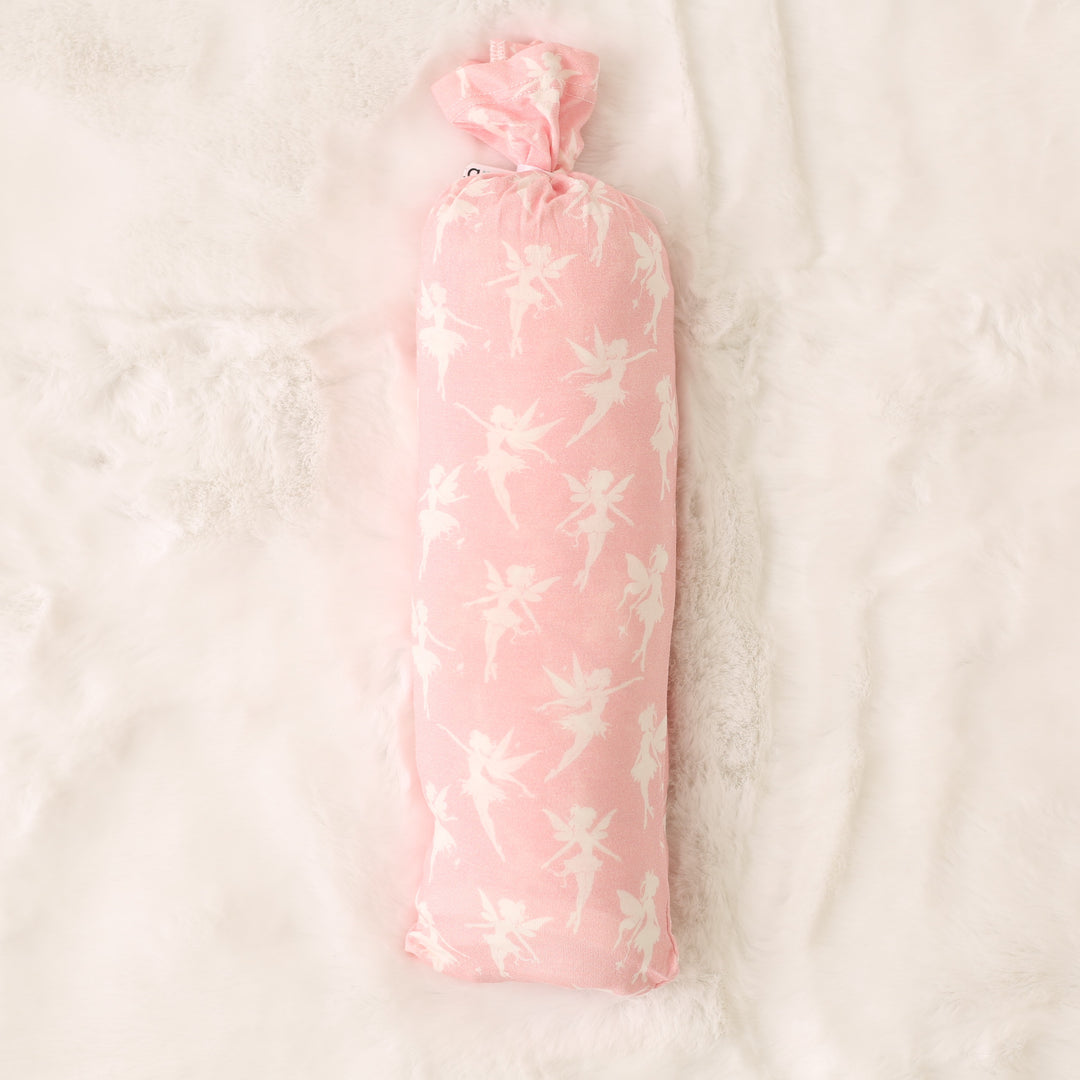 Pink floral-patterned bottle cover on a light beige background