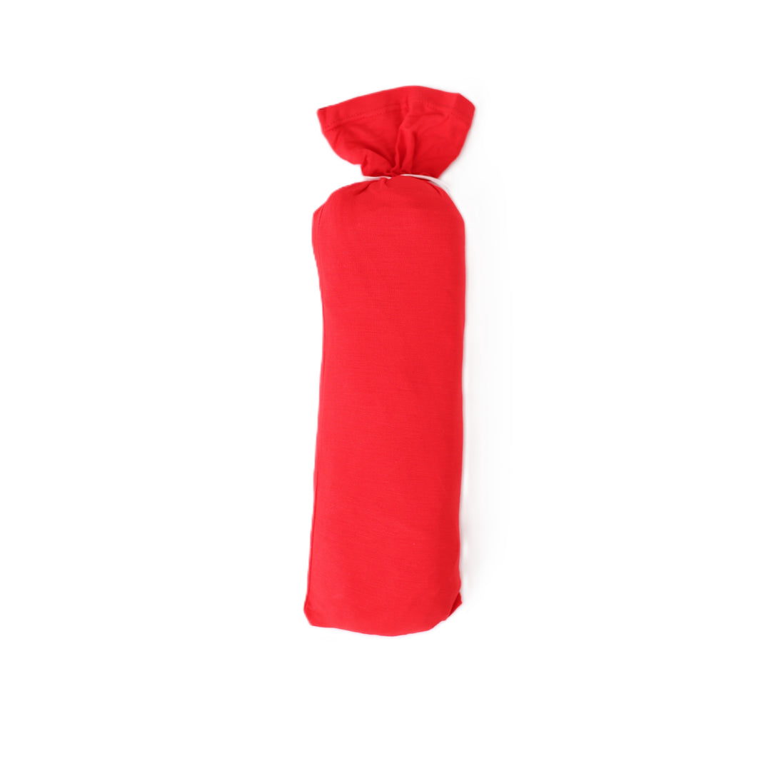 Red wine bottle wrapped in cloth on a white background