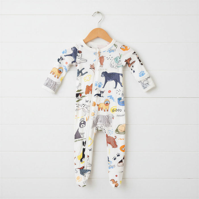 Children's onesie with animal pattern on a wooden hanger against a white background
