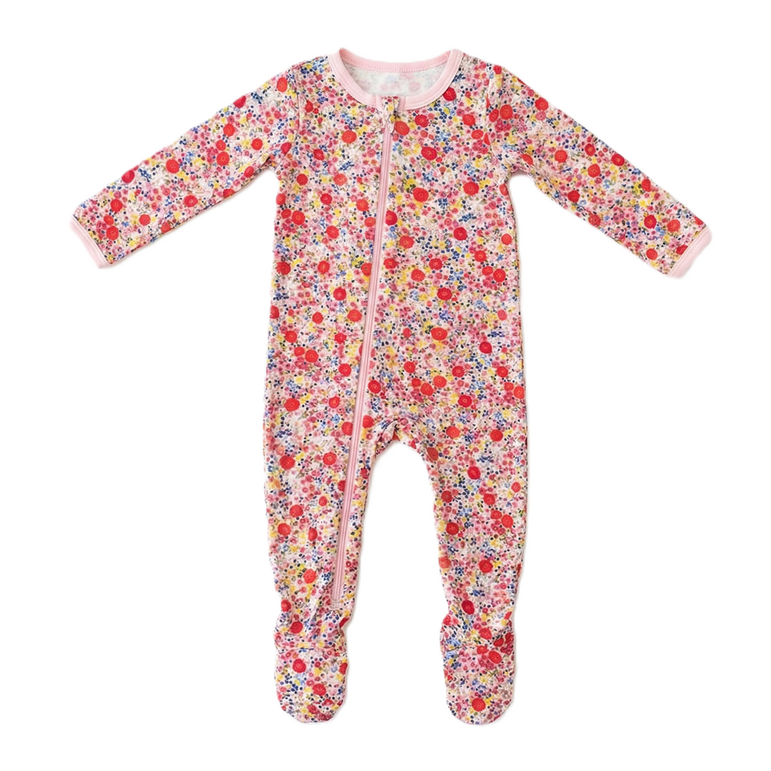 Floral patterned baby onesie on a white background